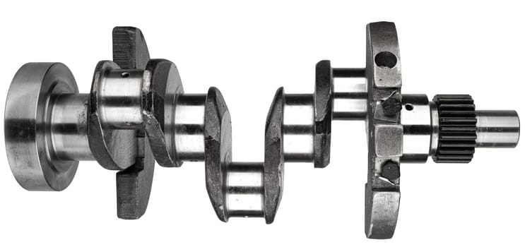 Crankshaft, spare part from car engine on white background in insulation