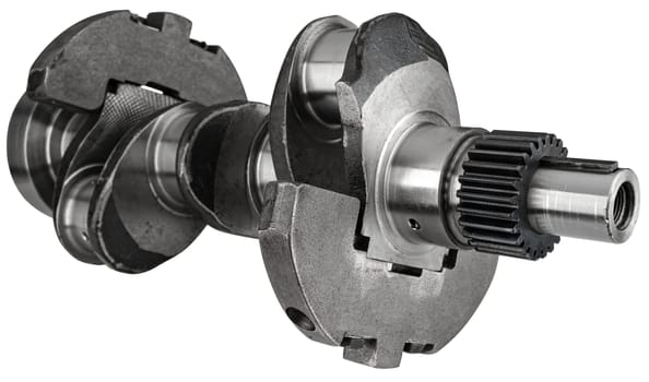 Crankshaft, spare part from car engine on white background in insulation