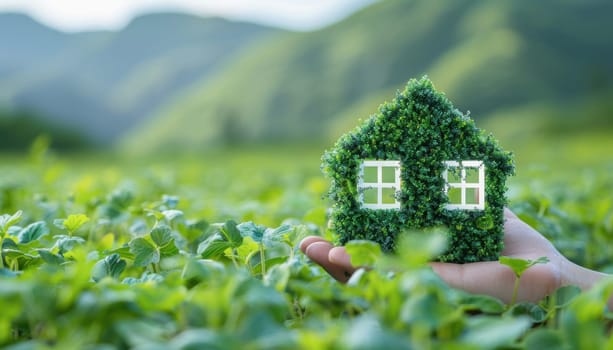 A person holds a grass house, merging nature with human interaction, displaying a harmonious blend of environments