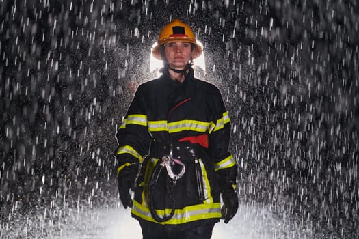 A determined female firefighter in a professional uniform striding through the dangerous, rainy night on a daring rescue mission, showcasing her unwavering bravery and commitment to saving lives