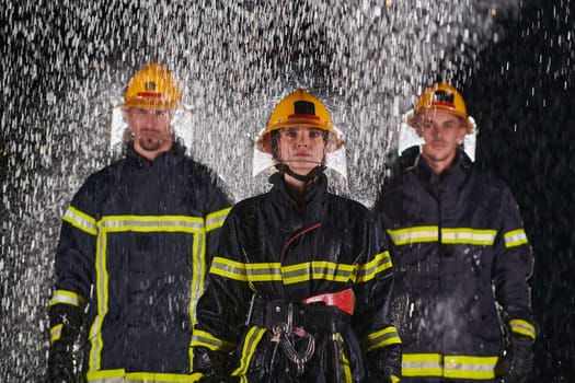 A group of professional firefighters marching through the rainy night on a rescue mission, their determined strides and fearless expressions reflecting their unwavering bravery and unwavering commitment to saving lives