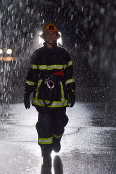 A determined female firefighter in a professional uniform striding through the dangerous, rainy night on a daring rescue mission, showcasing her unwavering bravery and commitment to saving lives