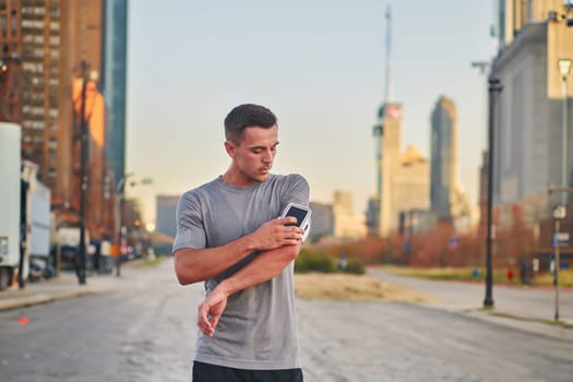 Handsome man checking his smartphone after a morning run on the vibrant streets of New York City, seamlessly blending his active lifestyle with the modern convenience of technology, as he engages with digital updates, social media, and music, immersing himself in the energetic and cosmopolitan atmosphere of the urban landscape