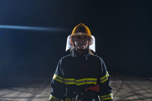 Portrait of a female firefighter standing and walking brave and optimistic.