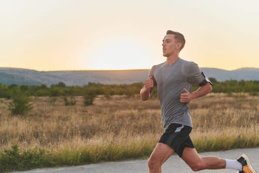 A young handsome man running in the early morning hours, driven by his commitment to health and fitness. High quality photo