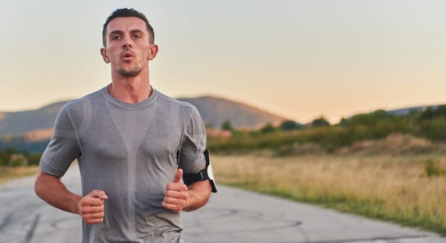 A young handsome man running in the early morning hours, driven by his commitment to health and fitness. High quality photo