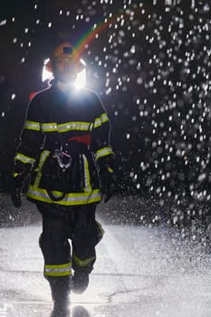 A determined female firefighter in a professional uniform striding through the dangerous, rainy night on a daring rescue mission, showcasing her unwavering bravery and commitment to saving lives