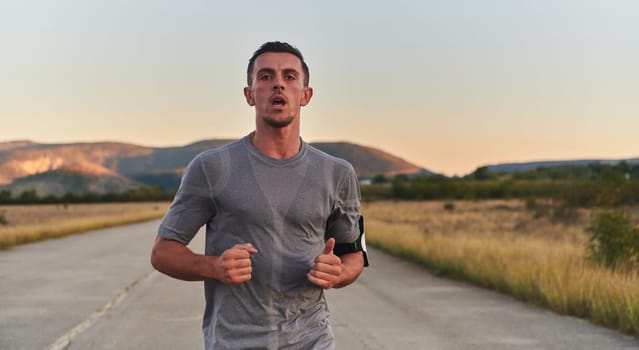 A young handsome man running in the early morning hours, driven by his commitment to health and fitness. High quality photo