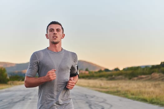 A young handsome man running in the early morning hours, driven by his commitment to health and fitness. High quality photo