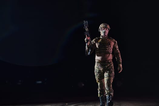 A professional soldier in full military gear striding through the dark night as he embarks on a perilous military mission.