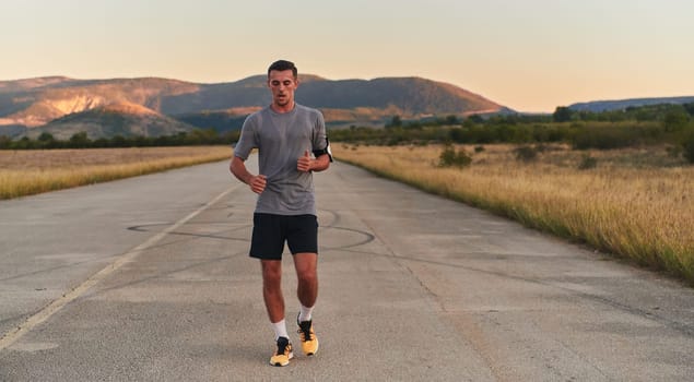 A young handsome man running in the early morning hours, driven by his commitment to health and fitness. High quality photo