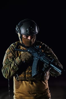 A professional soldier in full military gear striding through the dark night as he embarks on a perilous military mission.