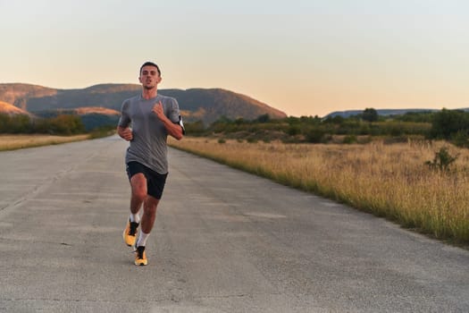 A young handsome man running in the early morning hours, driven by his commitment to health and fitness. High quality photo