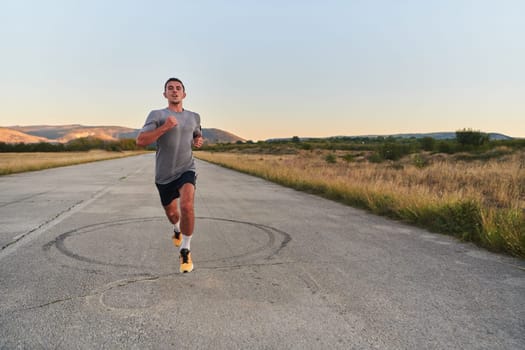 A young handsome man running in the early morning hours, driven by his commitment to health and fitness. High quality photo