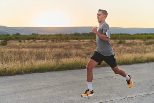 A young handsome man running in the early morning hours, driven by his commitment to health and fitness. High quality photo