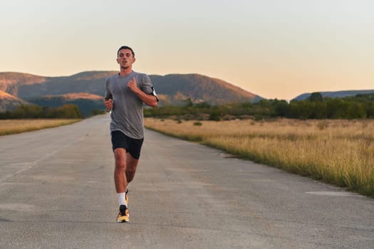 A young handsome man running in the early morning hours, driven by his commitment to health and fitness. High quality photo