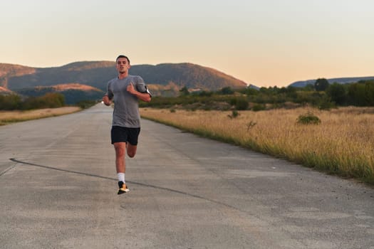 A young handsome man running in the early morning hours, driven by his commitment to health and fitness. High quality photo