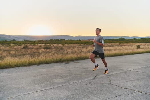 A young handsome man running in the early morning hours, driven by his commitment to health and fitness. High quality photo