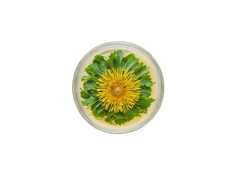 Dandelion Tea Detoxifying dandelion tea in a sleek glass with dandelion leaves and a healthful. Drink isolated on transparent background.