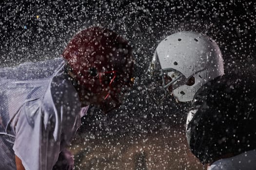 Two american football players face to face in silhouette shadow on white background.