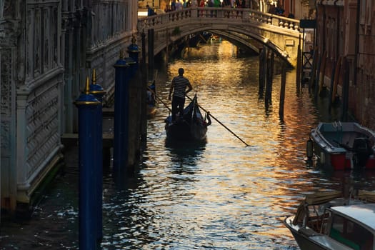 Venice cityscape and canal with gondola ride  in Italy