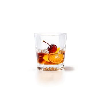 Old Fashioned glass short and filled with deep amber bourbon cocktail one empty and one. Food isolated on transparent background.