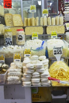 many type of cheeses on shop window.