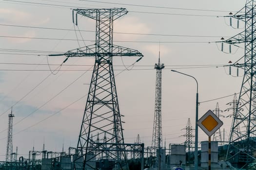 Power transmission lines on supports with ceramic insulators and transformers at large electrical distribution substation