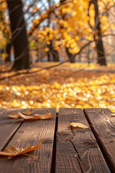 Wooden table in the autumn park. Selective focus. Nature.