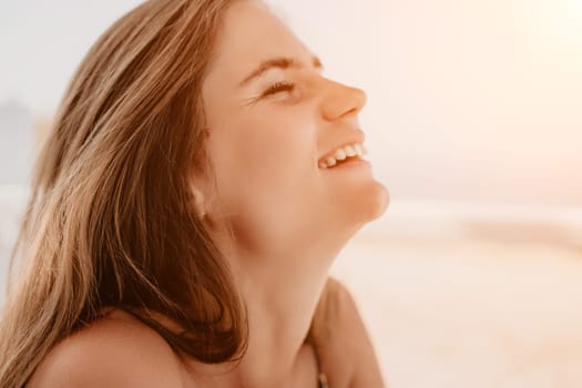 Happy woman portrait in cafe. Boho chic fashion style. Outdoor photo of young happy woman with long hair, sunny weather outdoors sitting in modern cafe