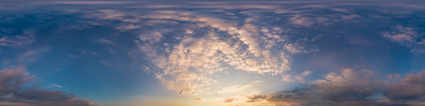 Bright sunset sky panorama with Cirrus clouds. Seamless hdr spherical equirectangular 360 panorama. Sky dome or zenith for 3D visualization, game and sky replacement for aerial drone 360 panoramas.