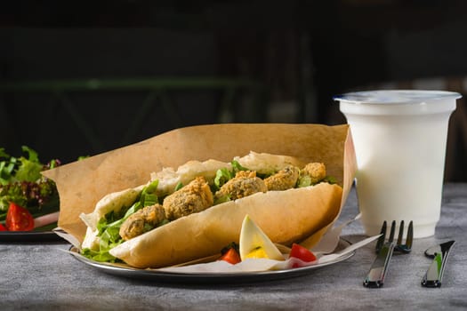 Deep fried mussels in bread and with greens on the side. Turkish name Midye Tava