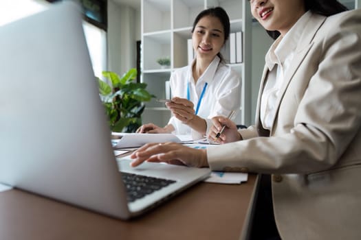 Laptop, collaboration and business people in the office while working on a company project. Technology, teamwork and team doing corporate research.