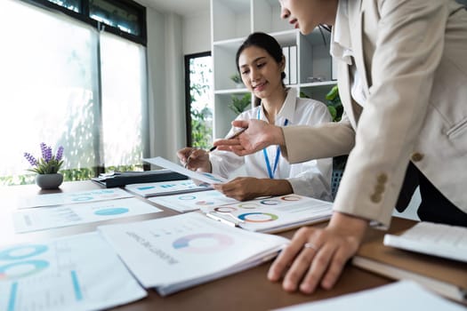 business woman discussing strategy in office. colleagues collaborating on business report.