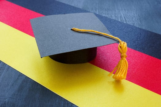 The Graduation cap on the German flag as symbol of education in the country.