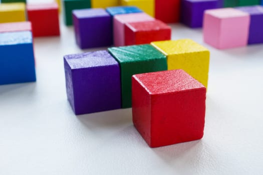 The structure of abstract labyrinth from colored cubes. Difficult interaction in the company.