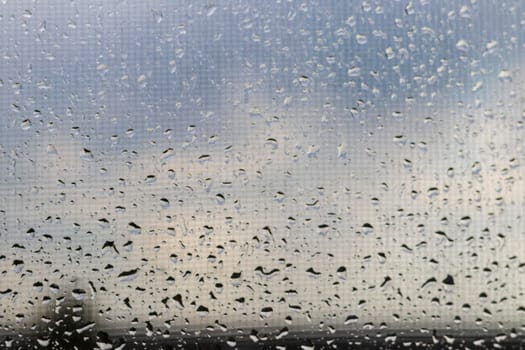 Close up shot of the rain drops on the window