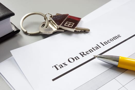 A key and papers about tax on rental income.