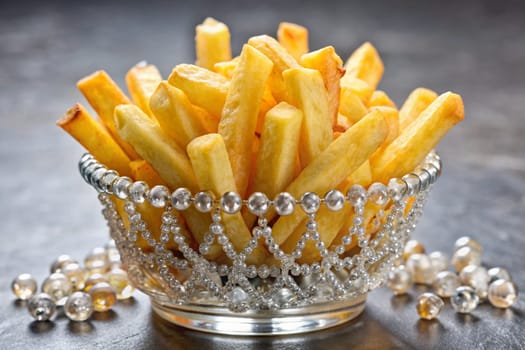 French fries in bowl with gems and crystals. Luxury fast food concept. French fries crown. Ai generated image