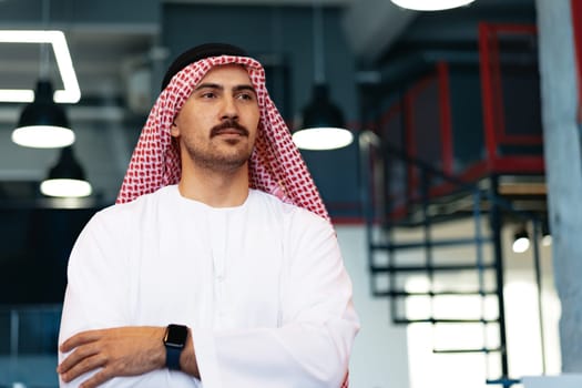 Successful muslim businessmen in traditional outfit in his office, portrait