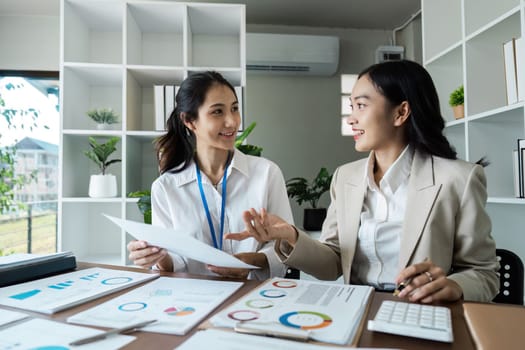 business woman discussing strategy in office. colleagues collaborating on business report.