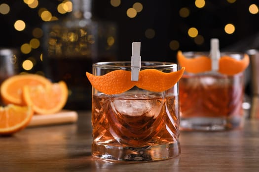 The Sharpie Mustache is a cocktail that's easy to make with equal parts rye whiskey, gin, sweet vermouth and a few drops of bitters, and garnished with a mustache-shaped orange zest