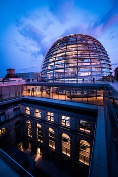 Berlin, Germany - 19 September 2020: Reichstag large glass dome and roof terrace at sunset