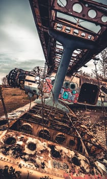 Vovchansk, Ukraine - 15 May 2020: Closeup view of old destroyed airplane wing. Abandoned military USSR aviation technique