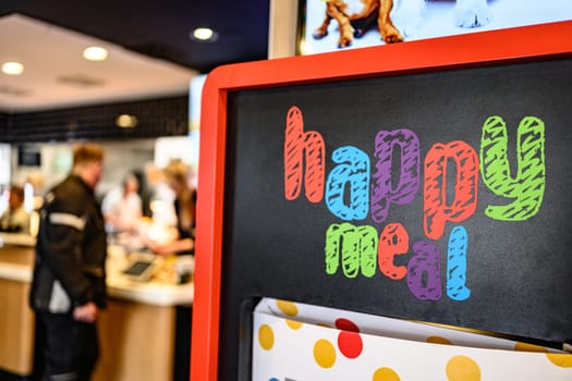 Berlin, Germany - 10 April 2023: advertising offer of Happy Meal in McDonald's