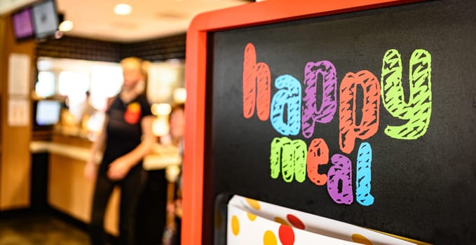 Berlin, Germany - 10 April 2023: advertising offer of Happy Meal in McDonald's