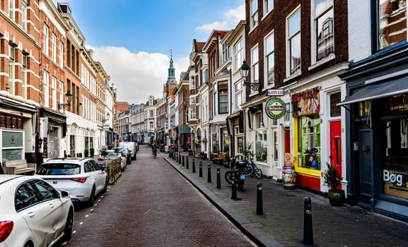 Hague, Netherland - 09 April 2023: Central Street of Hague in Holland tourist route of city, shops and attractions