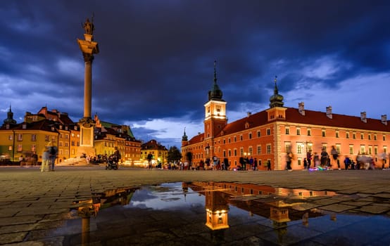 Warsaw, Poland - 10 August 2023: Amazing Night View Of Central Market Square With Historical Buildings And Sightings On The Market Square Of Warsaw In Poland, Evening Cityscape With Reflection