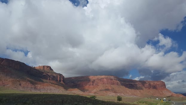 Thick Afternoon Clouds, Storm Forming Above Southwestern Red Rock Landscape. High quality photo