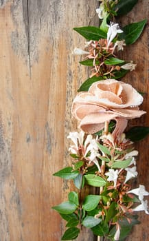 Grunge wood texture with empty space white and pinnk flowersbouquet.Romantic concept Copy space